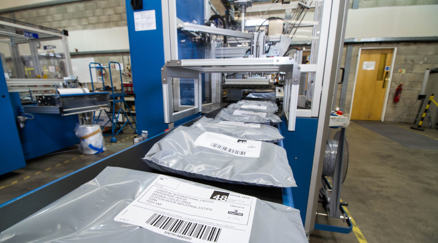 adpak apparel ecommerce conveyor packaging